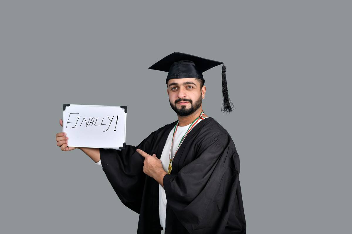 Person celebrating after final debt snowball motivation milestone with zero debt certificate