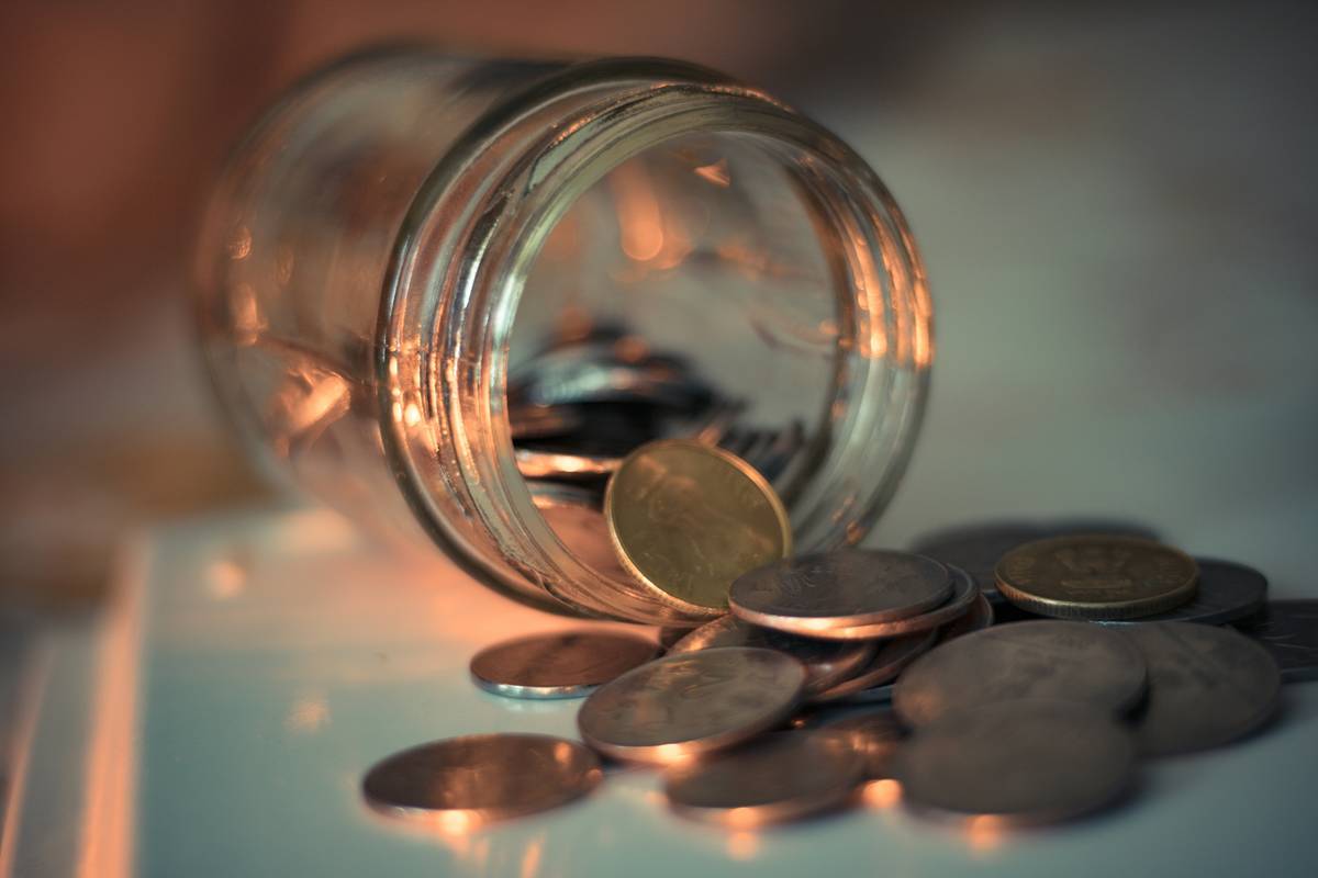 debt snowball method dave ramsey illustrated with stacked coins shrinking from smallest to largest balance